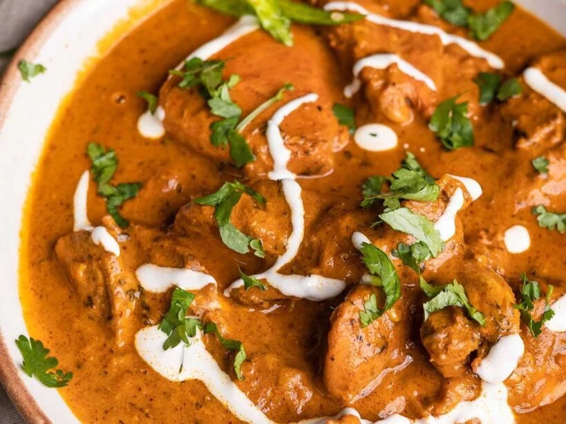 Butter Chicken - Tender chicken in rich creamy tomato curry at Royal Heritage Calgary